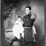 Gen. L. W. Colby holding Zintkala Nuni or Little Lost Bird, found on the Wounded Knee battlefield.