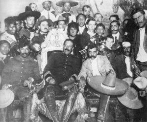 “Villa en la Silla.” Villa in the presidential chair after routing Carranza. Zapata is immediately to his left with the enormous sombrero.