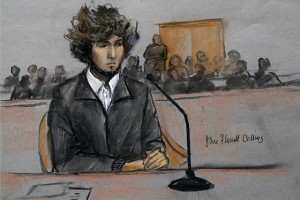 In this courtroom sketch, Boston Marathon bombing suspect Dzhokhar Tsarnaev is depicted sitting in federal court in Boston Thursday, Dec. 18, 2014, for a final hearing before his trial begins in January. Tsarnaev is charged with the April 2013 attack that killed three people and injured more than 260. He could face the death penalty if convicted.  (AP Photo/Jane Flavell Collins)