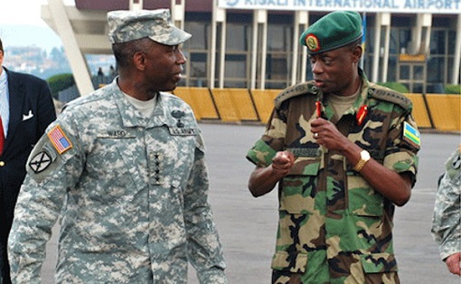 Minister Gen. James Kabarebe (R)---indicted by Spain for war crimes, crimes against humanity and genocide in Central Africa---speaks to US AFRICOM chief General William Ward in Rwanda, July 2010. (Photo credit AFRICOM)